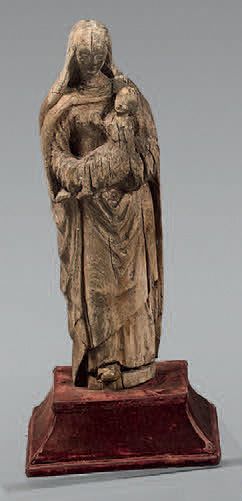 Vierge à l'Enfant en bois sculpté.
XVIIème...