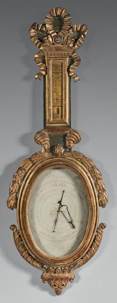 Baromètre thermomètre en bois doré sur un...