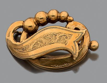 Lot en or jaune 18K (750) composé d'une clef...