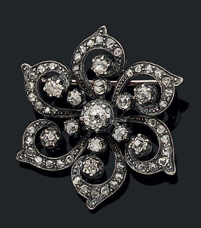 Broche rosace en or 18K (750) et argent à...