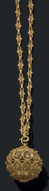 Sautoir et pendentif boule en or jaune 18K...