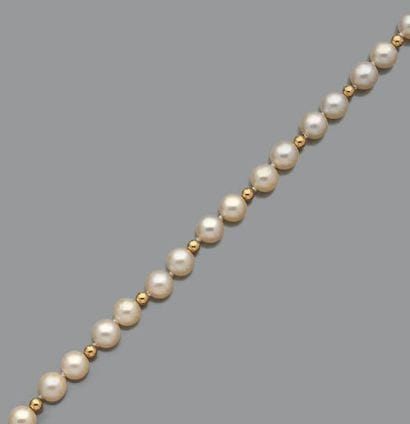 Collier et bracelet de perles de culture...