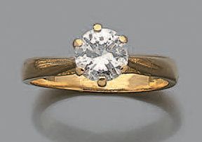 Bague en or jaune 18K (750) ornée d'un diamant...