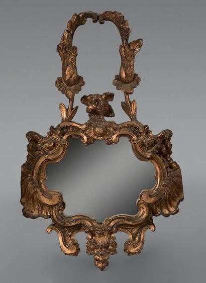 Miroir à entourage de forme contournée en...