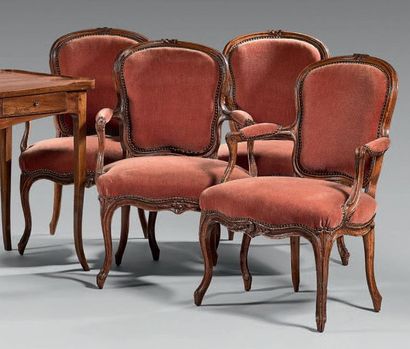Suite de quatre fauteuils en bois naturel...