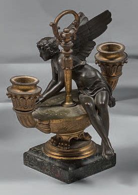 Lampe en bronze patiné et doré figurant une...