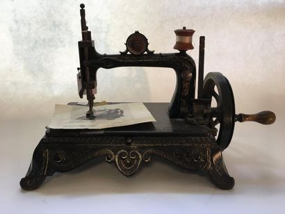 Machine à coudre en fonte.

Manques.