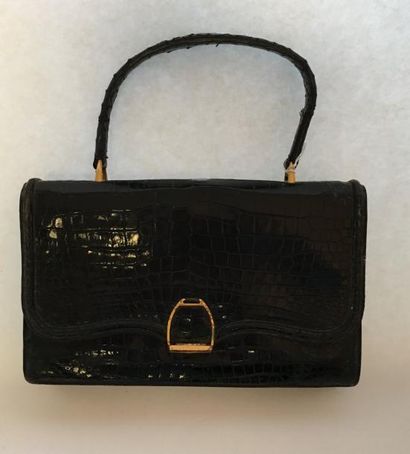 HERMES. Sac en crocodile noir, le fermoir...