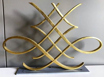 Pare-feu en bronze doré figurant des entrelacs,...