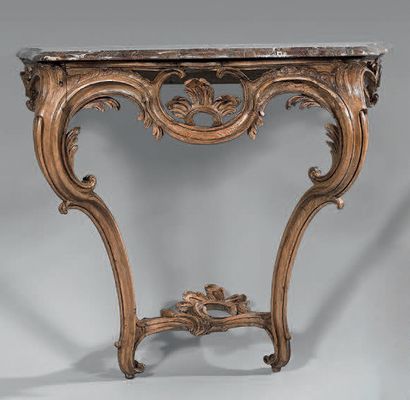 Console en bois naturel mouluré et sculpté...
