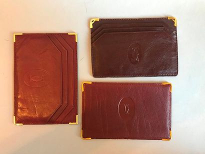 CARTIER. Lot de trois porte-cartes et un...