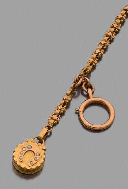 Chaîne giletière en or jaune 18K (750), articulée...