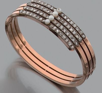 * Bracelet rigide ouvrant en or 14K (585)...