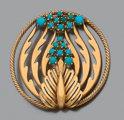 * Broche ronde en or jaune 18K (750), ajourée...