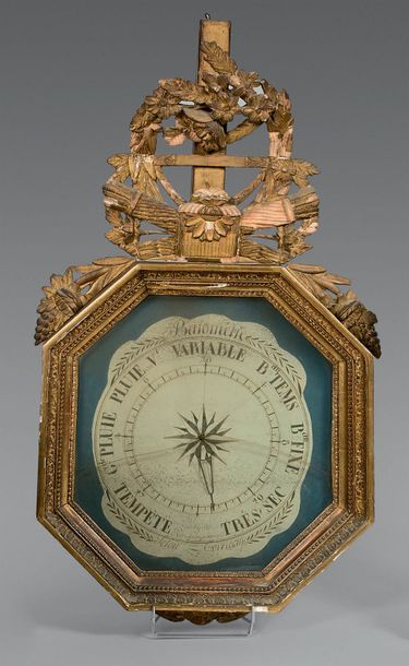 Baromètre en bois doré, l'encadrement de...