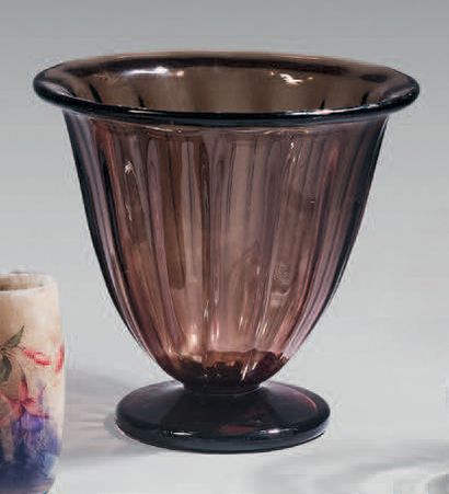 DAUM
Three glass vases, one smoked, the second...
