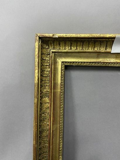 Wooden frame and gilded wood paste with palmette...