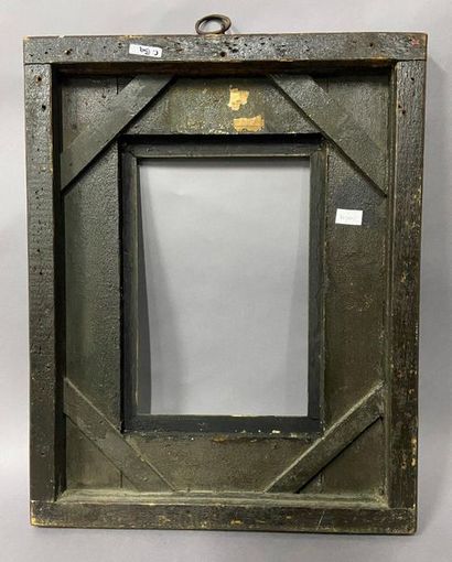 Blackened moulded wooden frame with reversed...