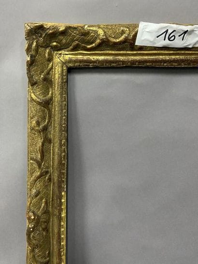 Carved and gilded oak frame with Bérain decoration

Louis...