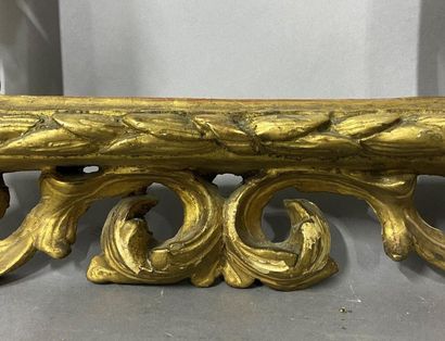Carved and openworked gilded linden frame...