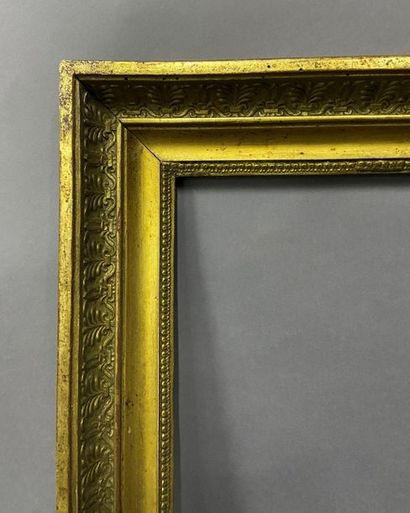 Wooden frame and gilded paste with palmette...