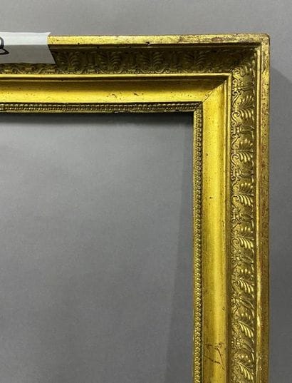 Wooden frame and gilded paste with palmette...