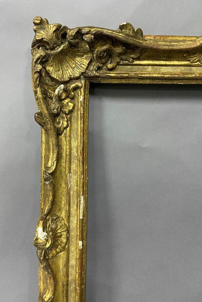 Sculpted and gilded lindenwood frame decorated...