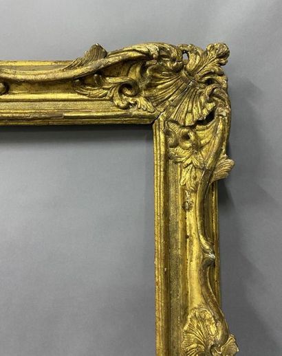 Sculpted and gilded lindenwood frame decorated...