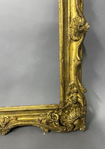 Sculpted and gilded lindenwood frame decorated...