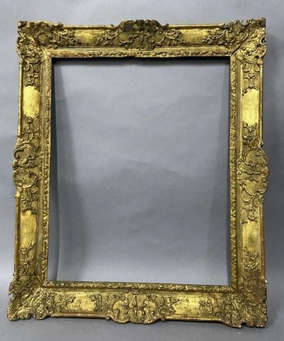 Sculpted and gilded oak frame with palmettes...