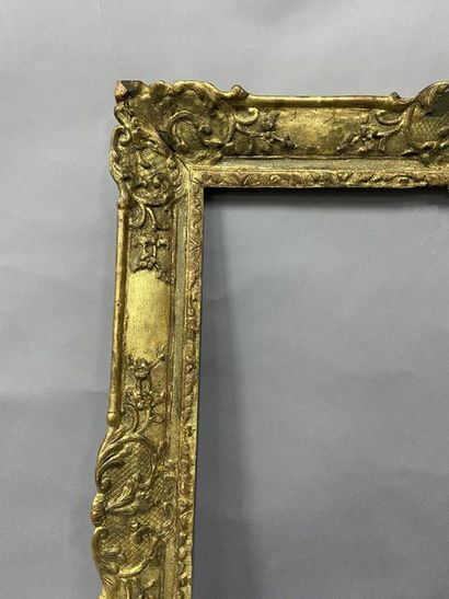 Sculpted and gilded oak frame with palmettes...