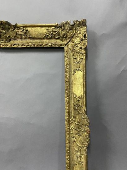 Sculpted and gilded oak frame with palmettes...