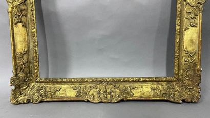Sculpted and gilded oak frame with palmettes...
