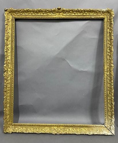 Carved and gilded oak frame with Bérain decoration...