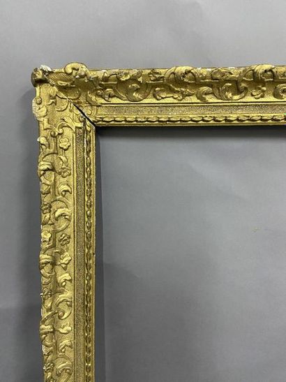 Carved and gilded oak frame with Bérain decoration...