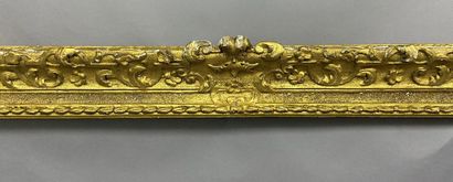 Carved and gilded oak frame with Bérain decoration...