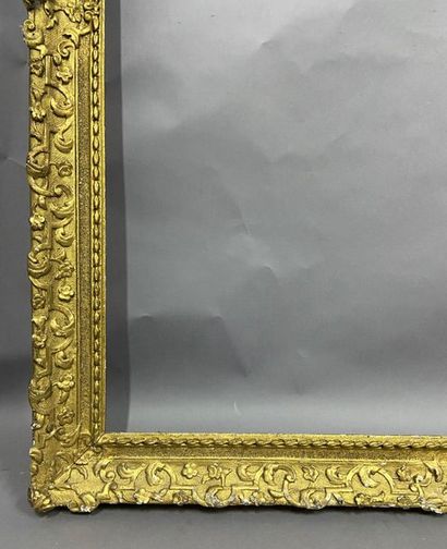 Carved and gilded oak frame with Bérain decoration...