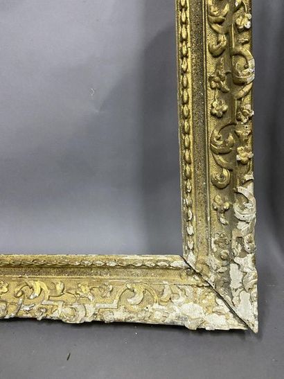 Carved and gilded oak frame with Bérain decoration...