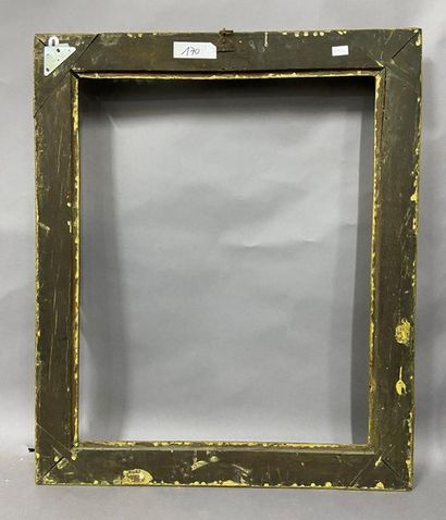 Sculpted and gilded oak frame with flower...