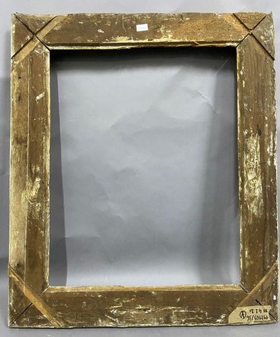 Carved and gilded oak frame with Bérain decoration...