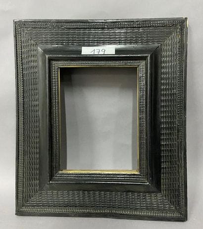 Moulded and blackened fir wood frame with...
