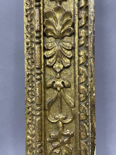Carved and gilded wood frame with rich decoration...