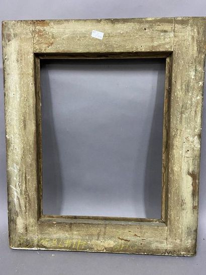 Carved and gilded wood frame with rich decoration...