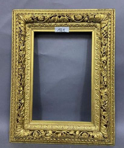 Carved and gilded wood frame with openwork...