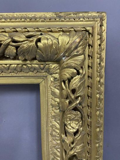 Carved and gilded wood frame with openwork...