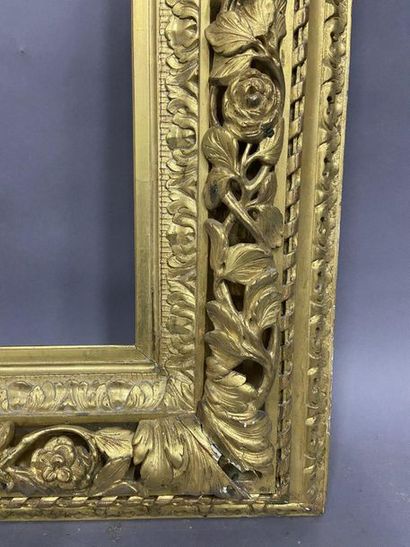 Carved and gilded wood frame with openwork...