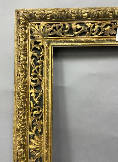 Carved and gilded wood frame with openwork...