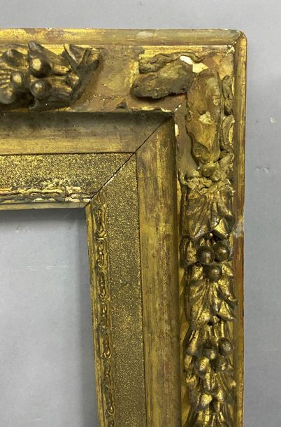 Wooden frame and gilded stucco in the Louis...