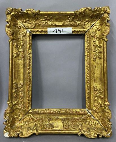 Sculpted and gilded oak frame with shells...