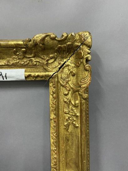 Sculpted and gilded oak frame with shells...